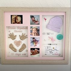 a baby's hand and foot casts are displayed in a shadow box with pink trim