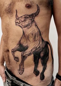 a man with a bull tattoo on his stomach