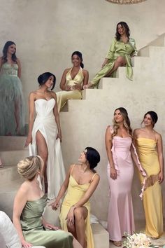 the models are all dressed in different styles and colors, posing for pictures on stairs