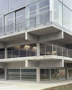 an apartment building with balconies on the second floor