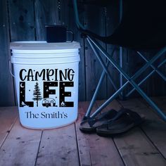 a camping life the smith's bucket next to a folding chair