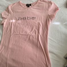 Brand New Bebe Pink T-Shirt Crystal Logo Size Xl These Run Smaller 16 Inches Bust Size Underarm To Bottom 14 1/2 Inches It Has Stretch Baby Tshirts Women, Cute Y2k Shirts, Bebe Shirt, Bebe Shirts, 2000 Clothes, 2000s Tops, Y2k Shirts, Bebe T Shirt, Mcbling Fashion