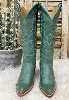 Make 'em green with envy in these new beautiful leather cowgirl boots from Black Star! The soft burnished goat leather on the upper shaft features dusty turquoise stitching that doesn't distract from the fabulous color of the leather. Note: Black Star calls these beauties dusty turquoise, in person the leather pulls a soft green hue. 15" Shaft Almond Toe 15" Calf Circumference CellSole Comfort 2" Western Heel Dark Green Cowboy Boots, Green Cowgirl Boots, Teal Cowboy Boots, Green Cowboy Boots, Teal Boots, Turquoise Cowboy Boots, Cowboy Boots For Women, Cowgirl Boots Outfit, Leather Cowgirl Boots