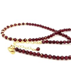 This gorgeous necklace is a blend of AAA quality, natural gemstone garnets. The beads are a deep red, juicy, berry color, similar to pomegranates and are extremely sparkly. These are the best quality garnet beads to be found! The 14k gold filled chain is adjustable from approximately 17”-19” and has a 14k gold filled lobster clasp. The garnet beads are 4 mm. This necklace is quite luxe looking due to the beautiful beads and large amount of 14k gold in the chain. Garnets are a January birthstone. Garnet Gemstone Necklace With Round Beads, Garnet Gemstone Beads Necklace, Garnet Necklaces With Faceted Beads For Gifts, Red Garnet Round Bead Necklaces, Faceted Garnet Round Bead Jewelry, Red Garnet Beaded Necklaces, Elegant Cranberry Garnet Jewelry, Elegant Garnet Necklace With Faceted Beads, Elegant Burgundy Jewelry With Faceted Beads