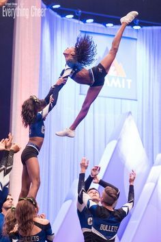 the cheerleaders are doing tricks for the crowd