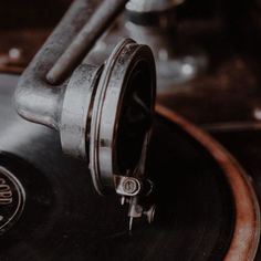 an old record player with its turntable and knobs on it's side