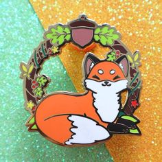 a close up of a pin with a fox on it