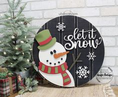 a wooden sign with a snowman on it