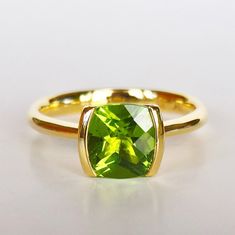 PERIDOT SOLITAIRE RING in 18k Gold  Contemporary by PratimaDesign Elegant Solitaire Peridot Ring, Classic Solitaire Peridot Jewelry, Peridot Solitaire Birthstone Ring, Classic Solitaire Peridot Ring, Polished Peridot Ring, Ring Pearl Modern, Gold Pearl Ring, Gold Statement Ring, Stacked Bangles