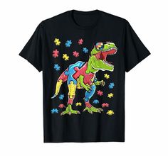 a t - shirt with an image of a dinosaur in the middle of puzzle pieces