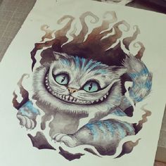 a drawing of a cat with blue eyes and fangs on it's face is shown