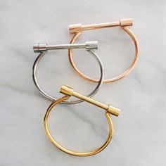 Modern and edgy, our Sara Screw Cuff features a timeless and classic design with a minimalistic flair. This is the perfect bracelet to layer with other bracelets or your watch. Material: Stainless Steel Colors: Gold Plated, Silver Plated, or Rose Gold Plated Dimensions: 2.5 in x 2 in Ear Jacket Earring, Earring Jackets, Henna Tattoo Designs, Zirconia Earrings, Moon Earrings, Vintage Bracelets, Henna Tattoo, Gold Plated Silver, Huggies Earrings