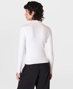 Our new ribbed cardigan for effortless everyday style. Soft, fine gauge ribbed knit. Slim fit with long sleeves and collar. Popper detailing down centre front. Front length: 47.5cm / 19”. Model wears size S and is 178cm/5'10" tall. Style Code: SB9680Colour: Lily White Fitted Ribbed Turtleneck Cardigan, Ribbed Turtleneck Cardigan For Spring, Fitted Turtleneck Cardigan With Ribbed Collar, Activewear For Women, Lily White, Knitted Tops, Ribbed Cardigan, Running Leggings, Sweaty Betty