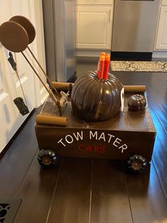 a toy car made to look like a town matere with pumpkins on top