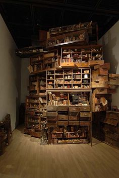 a room filled with lots of wooden boxes