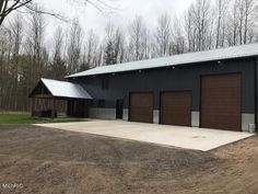 a large garage with two doors on the side of it