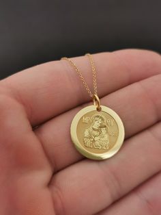 "14k Solid Gold 0.65 Inches Diameter Virgin Mary Necklace, Mother of God Pendant For Protection, Jesus Mother Necklace, Personalized Necklace 14K Solid Gold 16.5mm (0.65 Inch) Diameter Pendant ♥ Material of pendant and chain: Solid Gold 14K ♥ Packaging: All of our jewelry is beautifully boxed and ready for gifting For more personalized designs take a look here: ♥ www.etsy.com/listing/631444472 ♥ www.etsy.com/listing/645282627 ♥ www.etsy.com/listing/631455364 ♥ www.etsy.com/listing/645285037 ♥ ww Yellow Gold Pendant Jewelry For Memorial, Gold Necklace With Polished Finish For Mother's Day, Gold Polished Necklace For Mother's Day, Mother's Day Gold Polished Jewelry, Mother's Day Polished Gold Jewelry, 14k Stamped Pendant Jewelry For Mother's Day, 14k Stamped Round Pendant Jewelry For Commemoration, Round Jewelry With Polished Finish For Mother's Day, Yellow Gold Round Pendant Jewelry For Mother's Day