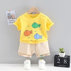 Grow Boy Cartoon Fish Patten Top & Solid Color Shorts - PrettyKid Spring Cotton Sets With Cartoon Print, Spring Cartoon Print Playwear Set, Playful Summer Sets With Cartoon Print, Yellow Sets For Playtime In Summer, Yellow Sets For Summer Playtime, Yellow Summer Sets With Short Sleeve, Yellow Short Sleeve Summer Sets, Spring Cartoon Print Playtime Sets, Yellow Summer Playtime Sets