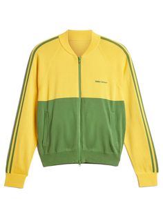 Knit track top in bold gold/crew green   from adidas originals x wales bonner    highlights  - yellow and green  - cotton  - 2-way center-front vislon zip  - zip pockets  - engineered 3 stripes on sleeve    for the ss24 season the adidas originals x wales bonner collection is inspired by the legacy of renown runner haile gebrselassie and ethiopia. the collection presents a refined collection of pieces inspired by the sport of running and elevates the products with luxury materializations and prints and patterns.     designer id: iw1174  colour id: bold gold/crew green Green Cotton Sporty Track Jacket, Green Cotton Track Jacket, Adidas X Wales Bonner, Banana Yellow, Wales Bonner, Comme Des Garcons Play, Adidas X, Issey Miyake, Knit Jacket