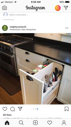 an open drawer in the middle of a kitchen