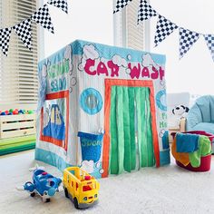 a child's playroom with toys and decorations on the floor in front of it