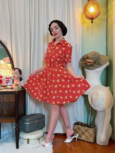 "How cute is this little 70s polka dot dress with floral flower bouquets?!  Even though it's not from this era it's giving me notebook coded vibes. It's just really romantic and sweet In amazing condition. Light Polyester fabric. Only buttons up the front no zipper closures.  Measurements: Bust: 40\" Waist: 28\"-30\" Hip free Length: 38\" Sleeve hole opening: 7\" (Note: the bust of this dress is the widest part of the dress in comparison to the waist. The fabric itself doesn't have any stretch but there is some give in the waist line and has room in the bust. Also note: this dress is a bit of an optical illusion colour wise because of the print. It's more of a red orange base tone leaning more to the red side in colour.) Any other questions I'd be happy to answer them! Ps follow us at @sta Polka Dot Dresses For Retro-themed Events, Summer Vintage Dress For Retro Events, Vintage Dresses For Retro-themed Spring Events, Spring Retro Dresses For Retro-themed Events, Spring Vintage Dress For Retro-themed Events, Retro Dresses For Spring Retro-themed Events, Vintage Dress For Retro-themed Spring Events, Retro Spring Dresses With Strawberry Print, Retro Dresses With Strawberry Print For Spring