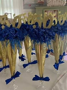 gold and blue centerpieces with numbers on them