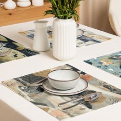 a table with placemats, plates and flowers in vase next to the plate