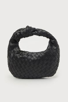 The Mejia Black Woven Knotted Handbag is ready to be your go-to accessory for girls' night out and everything in between! This ultra-chic handbag features a woven faux leather construction, a knotted handle, and a half-moon-inspired silhouette. A shiny gold zipper opens to reveal a lined, roomy interior with a zippered side wall pocket. Lined. Bag Measures 10. 5" Wide, 6. 5" Tall, And 1" Deep Relaxed. Shell: Polyurethane. Lining: Polyester. Do Not Wash. Imported. Lulus | Mejia Black Woven Knotte Oversized Clutch, Woven Handbags, Lulu Fashion, Side Wall, Leather Weaving, Chic Handbags, Wall Pockets, Gold Zipper, Personal Marketing