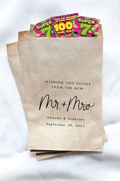 two brown paper bags with the words mr and mrs printed on them, sitting next to each other