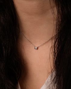 Add a sparkle of shine to your everyday look. This diamond bezel pendant set in your choice of 14k white or yellow gold is adjustable from 14 to 16 inches, enclosed by a lobster clasp. Its dainty style makes it perfect for everyday wear. Carat | 0.22 ctw (+/- .01cts)Clarity | VSColor | DEFCut | Radiant Note: In-stock products ship same-day or next-day depending on the time of your order. For made-to-order items please allow up to 1-3 weeks to ship your newest piece of fine jewelry. Everyday Dainty Solitaire Necklace With Diamond Accents, Everyday White Gold Solitaire Jewelry, Everyday Diamond Birthstone Necklace, Timeless Sterling Silver Solitaire Necklace For Everyday, Square Pendant Solitaire Necklace For Anniversary, Everyday Diamond Cut Solitaire Necklace, Fine Diamond Solitaire Necklace For Everyday, Anniversary Solitaire Necklace With Square Pendant, Fine Jewelry Diamond Solitaire Necklace For Everyday