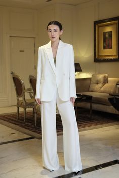 The pants appear impressively with a unique side pleated design that makes the item more elegant in a classic white. Wide legs form combined with high-quality silk material will bring a flowing and airy feeling to the wearer when wearing. Note:*Processing time takes 8-10 working days (including 5-7 working days for manufacturing and NOT including shipping time)**Backorder Definition- The product is low in stock and in case the customer purchased successfully after out of stock, the order will ne White Blazer White Pants Outfit, White Blazer And White Pants Outfit, Bride In Pants, White Bride Suit, White Full-length Pantsuit For Spring, White Full Length Pantsuit For Spring, Tailored White Wide Leg Pants, Modern White Formal Pants, Elegant Ankle-length Pants For Wedding