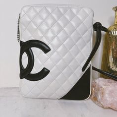 Please Note: Bag Has Been Meticulously Cleaned And Conditioned, White/Ivory Has Been Recolored At Corners And Places Where It Was Previously Badly Stained/Discolored. Black Leather Has Not Been Recolored In Any Way. Almost-Vintage Rare Chanel Bag, Cambon Ligne Crossbody In White/Ivory Quilted Lambskin Contrasted With Black Leather Cc, Strap, And Corner Accent. Double Crossbody Strap That Is Knotted In Attachment To Bag. Silver Zipper Pull Stamped With Chanel. Interior Pink Fabric Lining, Serial White Luxury Shoulder Bag With Mobile Phone Holder, Black And White Chanel Bag, Chanel Vintage Jumbo Flap, Chanel Graffiti Bag, Chanel Crossbody, Chanel Vintage Classic Double Flap Bag Quilted Lambskin Medium, Chanel $95.00 Bag, Silver Zipper, Quilted Leather