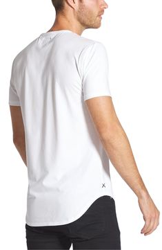 Fitted with a elongated silhouette and curved hem, this minimally-styled tee made from a soft cotton blend is ideal for everyday wear. Crewneck Short sleeves 62% polyester, 33% cotton, 5% spandex Machine wash, dry flat Imported Relaxed Fit T-shirt With Curved Hem For Everyday, Cotton Athleisure Tops With Minimal Stretch, Stretch Cotton T-shirt With Shirttail Hem, Stretch Cotton T-shirt In Athleisure Style, Cotton Stretch T-shirt With Shirttail Hem, Modern Cotton Tops With Shirttail Hem, Modern Cotton Top With Shirttail Hem, Modern Stretch T-shirt For Everyday, Minimalist Stretch Cotton T-shirt