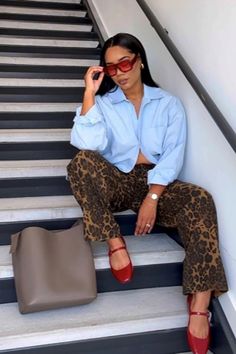 woman sitting on stairs with leopard print pants and blue button-down shirt Pretty Much, Faux Fur Coat, Fun Prints, Cashmere Sweater, Cashmere Sweaters, Fur Coat