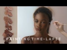 a woman is painting her face with acrylic paint and the words painting time - lapse