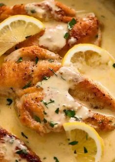 chicken with lemons and sauce in a skillet