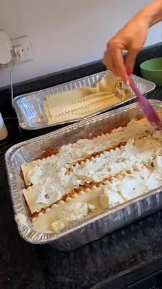 two pans filled with food on top of a stove