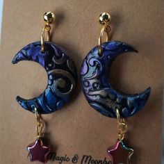 pair of earrings with moon and star charms