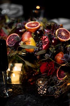 a table topped with lots of different types of fruit