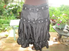 "Black taffeta sequin trim flouncy skirt. The Limited label made in India fully lined dressy black skirt.T shirt to sequin top skirt Fun boho skirt. US size 8' Like new vintage. 52% nylon 48\" poly.100% polyester lining. Waist 32\" flat waistband, back zipper Hip 43\" Length 24\" Hem 80\" ruffled" Flouncy Skirt, Low Waist Skirt, Taffeta Skirt, Handmade Skirts, Wedding Skirt, Boho Skirt, Formal Skirt, Fringe Sweater, Party Skirt