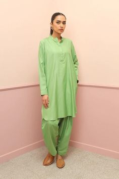 A Co Ord Set- Short length tunic with cuffed sleeves and round neckline. Paired with matching shalwar. Size: UK 12, -  FABRIC Shirt: Viscose Lower: Viscose LENGTH Sleeve Length: Full Shirt Length: Short CARE INSTRUNCTIONS Do not bleach Hand wash cold Line dry in shade Do not wring dry Iron on medium heat Wash/dry light and dark colours separately Traditional Green Sets For Work, Traditional Kurta For Workwear, Traditional Green Kurta For Work, Traditional Palazzo Set For Workwear On Eid, Traditional Palazzo Set For Workwear And Eid, Traditional Palazzo Set For Eid Workwear, Traditional Eid Palazzo Set For Workwear, Traditional Eid Workwear Palazzo Set, Pista Green Long Sleeve Traditional Wear