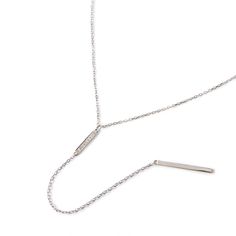 description This dainty minimalist Bar Lariat Necklace hangs on a diamond cut cable chain from our signature O Collection. Pair it with other necklaces from this collection. Our patented connectors let you easily link and layer necklaces in any order you desire. end description details Drop Height 4.4in (11.2cm) Adjustable chain: 15-17in (38-43cm) When layered, chain length is: 15-21in (38-53cm) Learn more end details materials .925 Sterling Silver Spring clasp closure Hypoallergenic, lead and n Luxury White Gold Lariat Necklace With Adjustable Chain, Delicate Layered Necklace, Layer Necklaces, Lariat Necklace Silver, Minimalist Bar, Layered Chain, Layered Chokers, Layered Necklace Set, Tarnished Silver