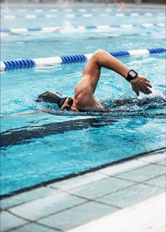 a man is swimming in the pool