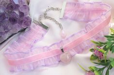 💗~ 💜Description These Pastel Purple and Pink colors Chokers made of Chiffon lace, Velvet ribbon, Rose Quartz and Amethyst pendant  ♡~  Chokers are 2 sizes: ★~ The shortest Choker minimal size- 34 cm(13.38in), maximal- 42cm(16.53in), height- 3cm(1.18in) ★~The longest Choker minimal size- 36 cm(14.17in), maximal- 45cm(17.71in), height- 3cm(1.18in) Heart pendant size- height- 1.7cm(0.66in), width - 1.5cm(0.59in) ★The choker's finished off with full width bright silver plated clamp ends, Zinc Alloy chains, Pink and Purple Teardrop Crystal Glass Beads. ♡~ Rose Quartz is the stone of universal love. ♥ Unconditional love ♥ Self-love ♥ Mother love ♥ Caring ♥ Kindness ♥ Friendship ♥ Romantic love ♥ Platonic love Rose Quartz purifies and opens the heart at all levels to promote love, self-love, fr Pink Heart Choker As Gift, Pink Heart-shaped Choker As A Gift, Pink Heart-shaped Choker For Gifts, Pink Heart-shaped Choker Gift, Cute Pink Handmade Choker, Cute Handmade Pink Choker, Cute Adjustable Ribbon Jewelry, Adjustable Pink Ribbon Necklace, Purple Choker