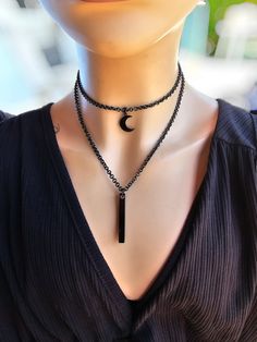 This is a blackened steel layered multi-strand goth punk aesthetic Necklace choker with a bar and moon pendant. it is all one necklace.  The minimalist design gives it a trendy and stylish feel, while the black steel gives it a touch of gothic Punk edge. The size is approximately 14" to 16" with a built-in extender.. 💗NOTE ABOUT DELIVERY TIMES FOR FREE SHIPPING💗 This is shipped via tracked package. It is not the quickest way to ship, but I am trying to save you money by offering you free (or n Edgy Black Alloy Jewelry, Adjustable Black Grunge Jewelry, Black Grunge Jewelry With Adjustable Chain, Black Metal Moon Shaped Jewelry, Black Metal Moon-shaped Jewelry, Black Metal Jewelry With Moon Charm, Black Grunge Choker Jewelry, Handmade Black Alloy Jewelry, Handmade Black Alloy Necklaces