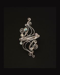 "Add a stylish and individual touch to your outfits with one of my hand crafted arm cuff. Beautiful  and elegant arm cuff is carefully handcrafted made out of silver plated copper wire, and wrapped with  swarovski crystal  10mm. Measurement :  The length of design is 6 inches and  armcuff is adjustable from  is 7.5\" to 15.50\" in circumference. Arm Bracelet or bracelet cuff is easily adjusted with light pressure to custom fit your arm . For measuring the right sizing, please use a string or tap Modern Twist Silver Jewelry For Party, Elegant Spiral Jewelry With Unique Design, Silver Wire Wrapped Bangle Cuff Bracelet, Wire Wrapped Bangle For Party, Wire Wrapped Bangle Jewelry For Parties, Silver Wire Wrapped Cuff Bracelet Gift, Adjustable Silver Fusion Cuff Bracelet, Elegant Silver Wire Wrapped Cuff Bracelet, Modern Twist Silver Wire Wrapped Jewelry