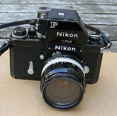 a camera sitting on top of a wooden table