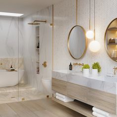 a bathroom with marble counter tops and gold accents