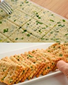 there is a white plate with crackers on it and someone holding a fork in the middle